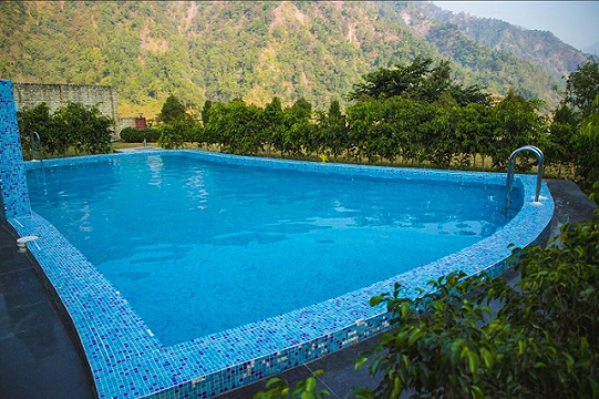 Swimming pool with mountain view camps in Rishikesh