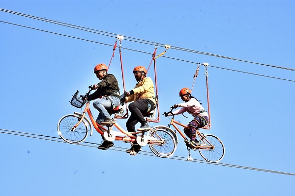 People are sky cycling in Rishikesh.